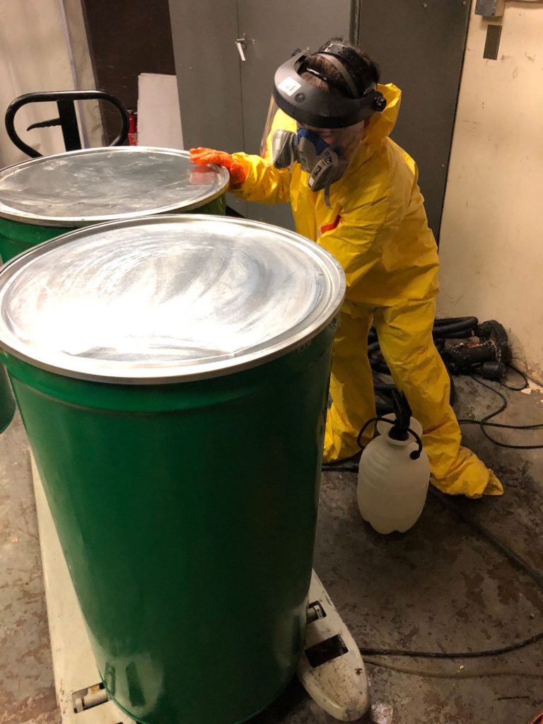 technician disinfecting a room